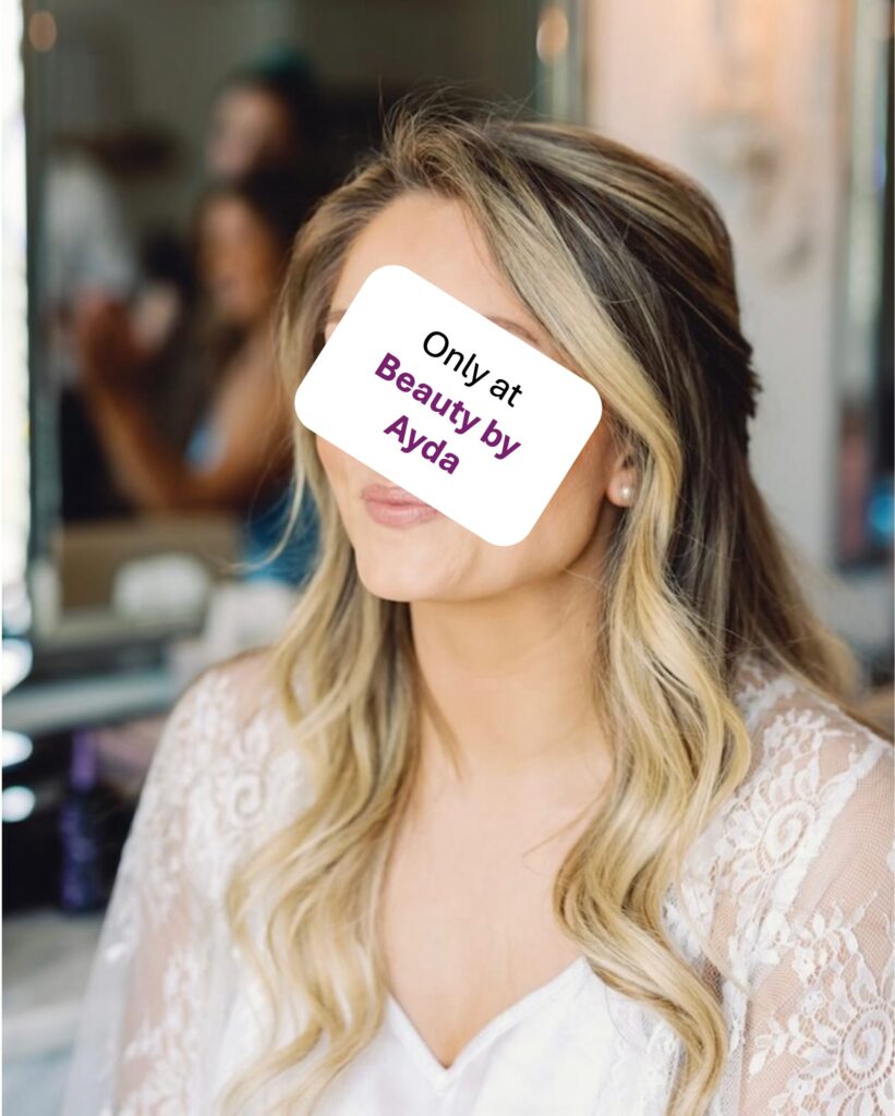Bride in white has hair half up and half down with slight waves, spotlighing Ayda Ghaffari's skill in styling hair for special events.